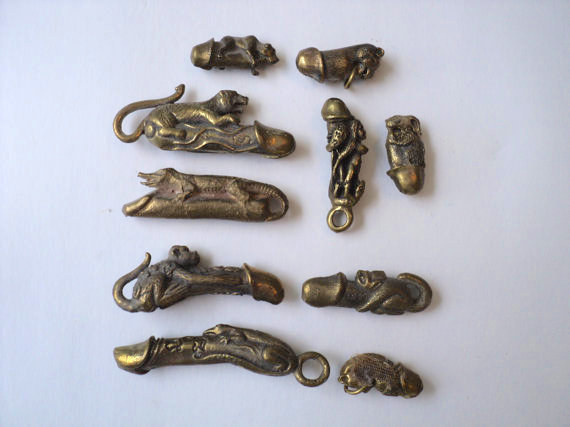 This collection of bronze fertility charm pendants.